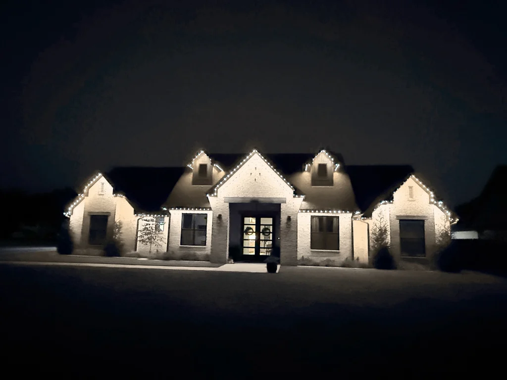 Simulated color preview: the same Lonestar install shown with warm white rooflines instead of blue